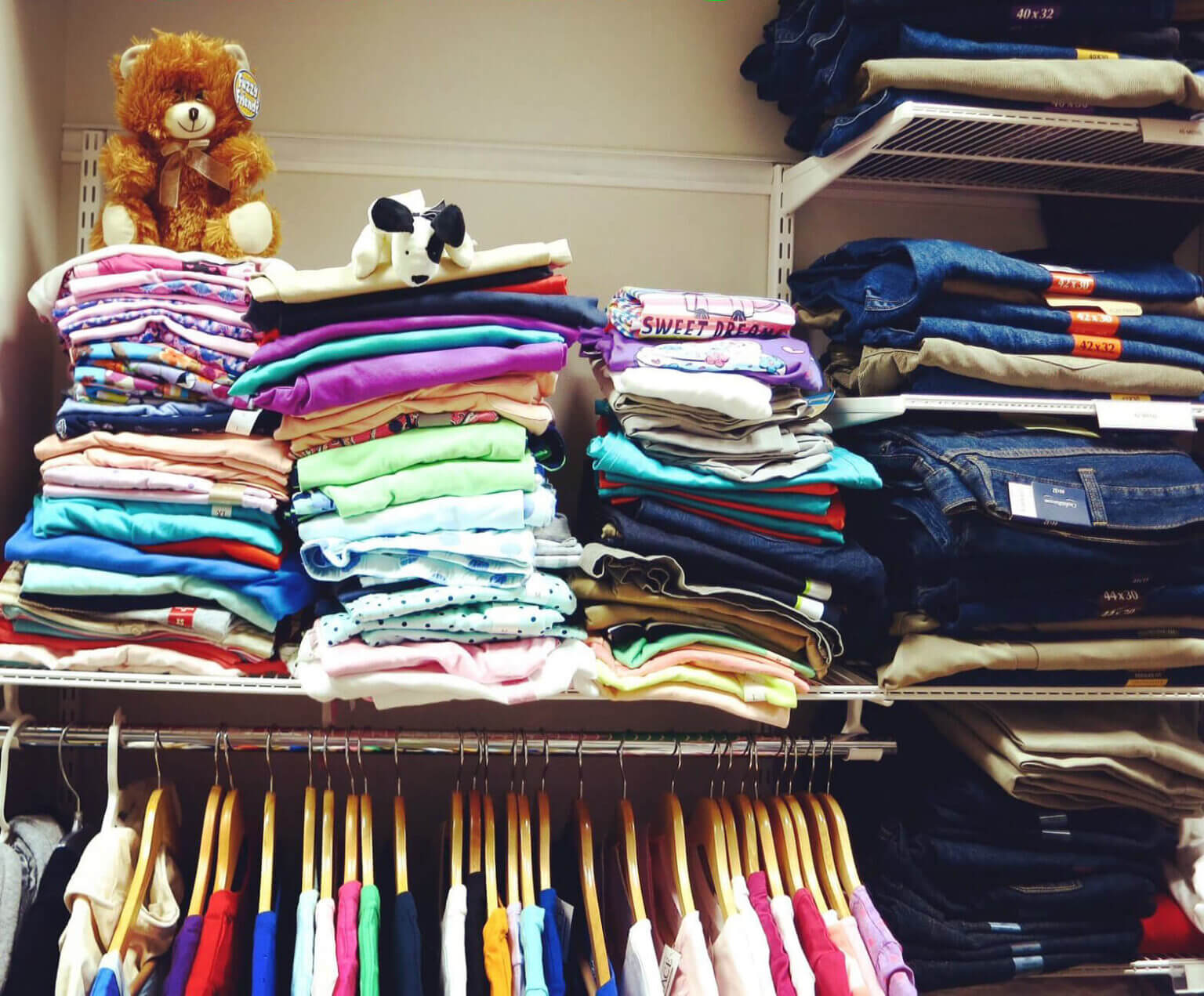 Stacks of clothes in the clothing closet at Safe Shores.